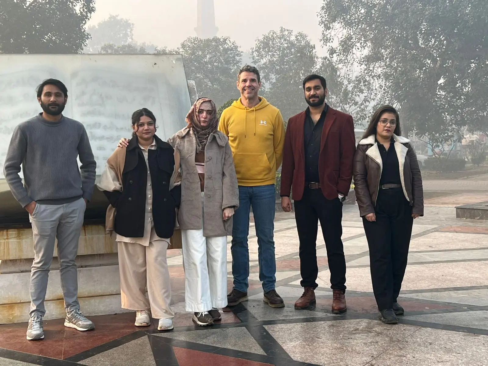 Jason Todd with business contacts during a visit to Pakistan